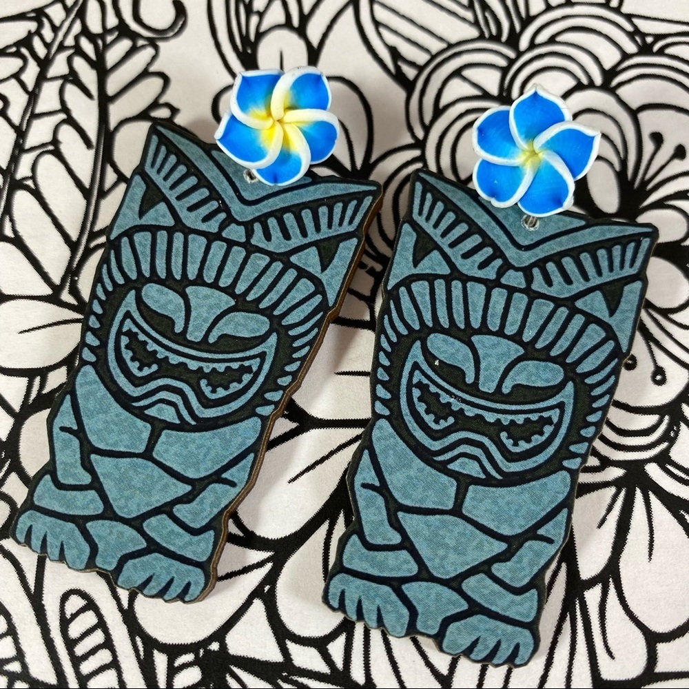 Vintage tiki images printed on laser cut wood and adorned with handmade Plumaria